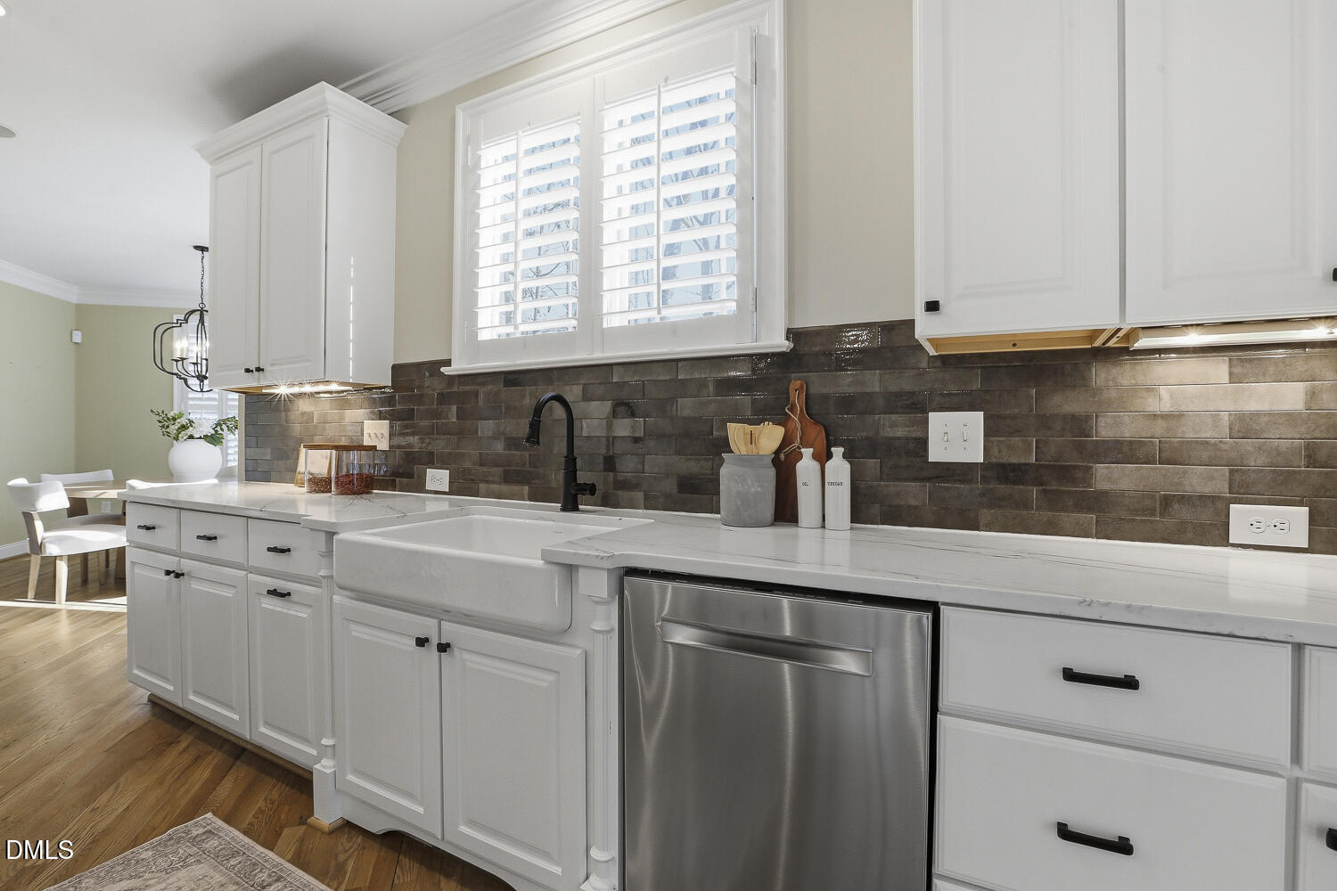 3124 Briar Stream Run Raleigh, NC 27612 - Photo 7 of 57 a kitchen with white cabinets and white appliances
