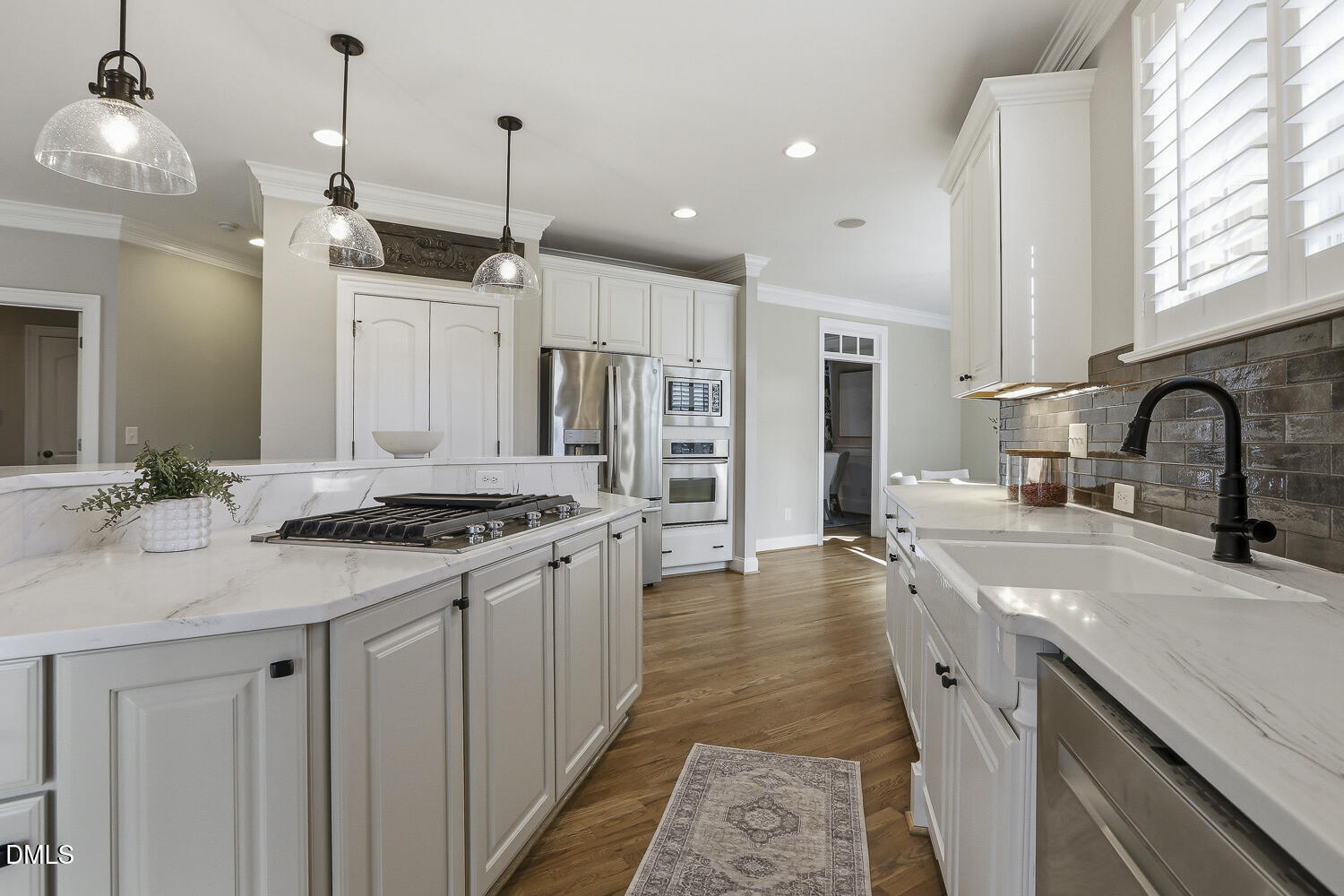 3124 Briar Stream Run Raleigh, NC 27612 - Photo 8 of 57 a kitchen with stainless steel appliances granite countertop a sink stove and cabinets