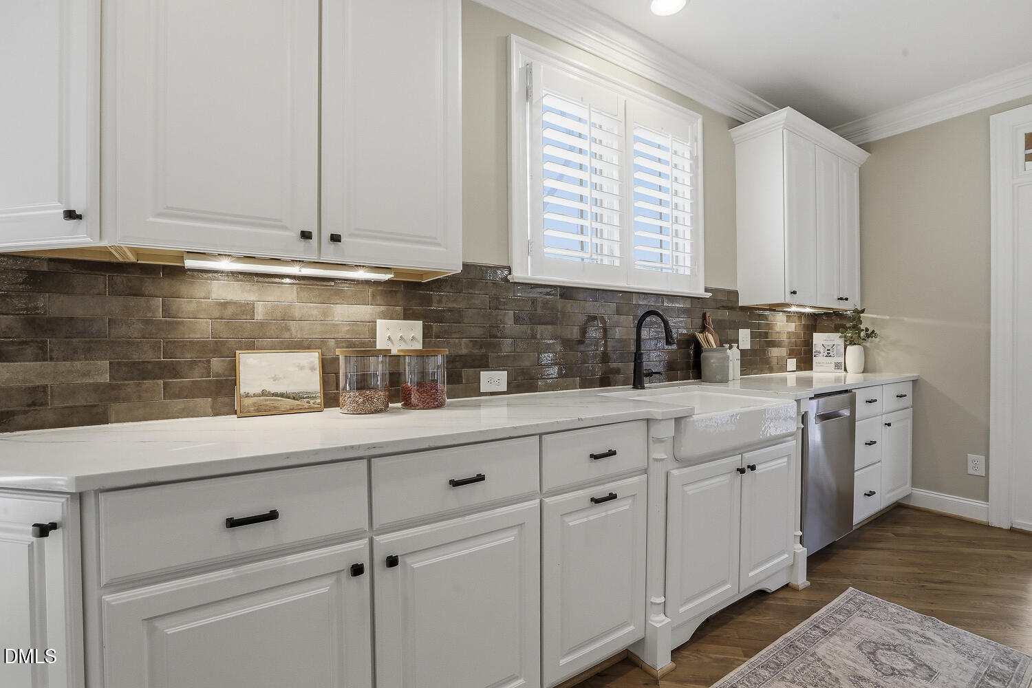 3124 Briar Stream Run Raleigh, NC 27612 - Photo 10 of 57 a kitchen with white cabinets and white appliances