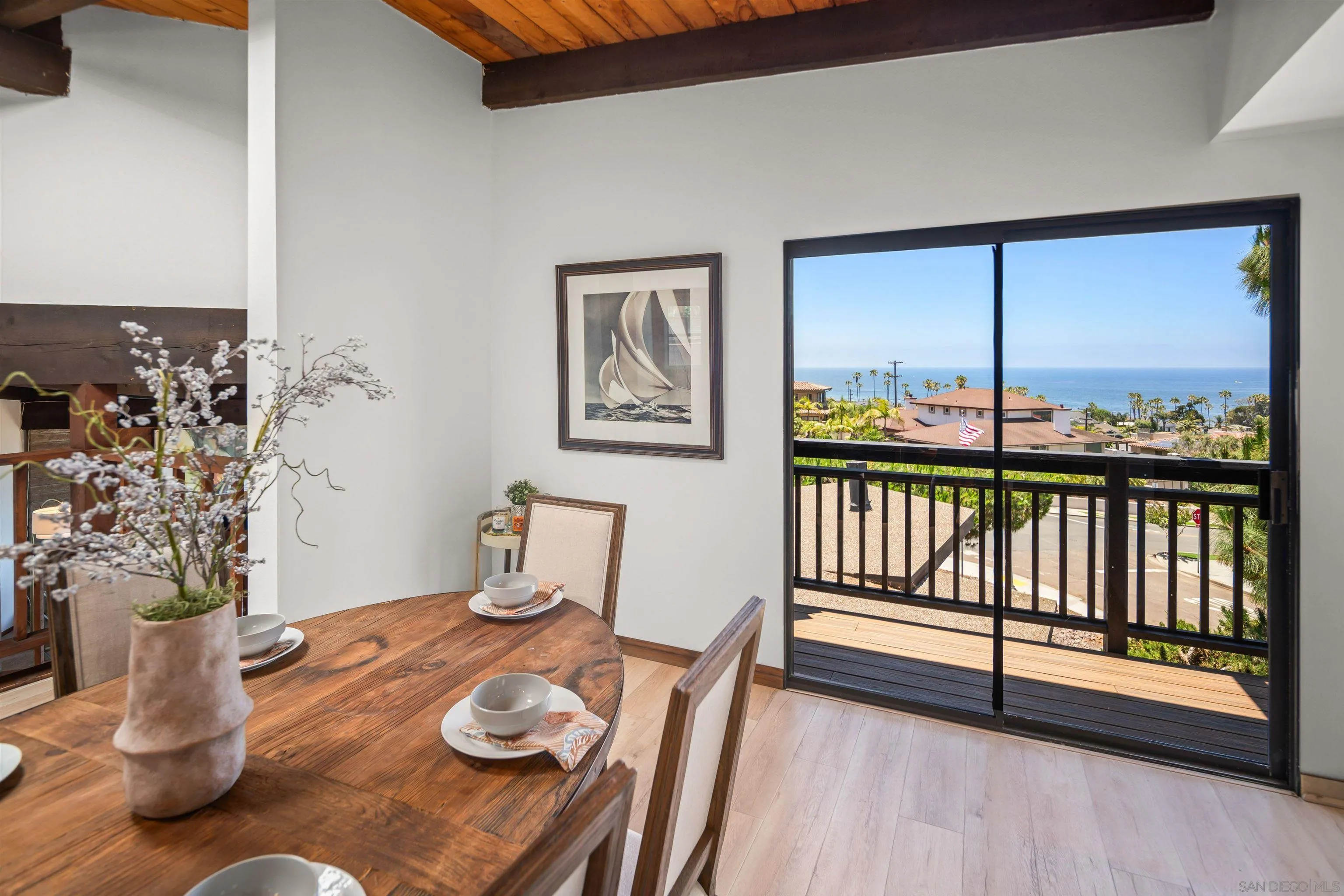 1005 Cornish Drive San Diego, CA 92107 - Photo 12 of 71 a view of a dining room with furniture window and wooden floor
