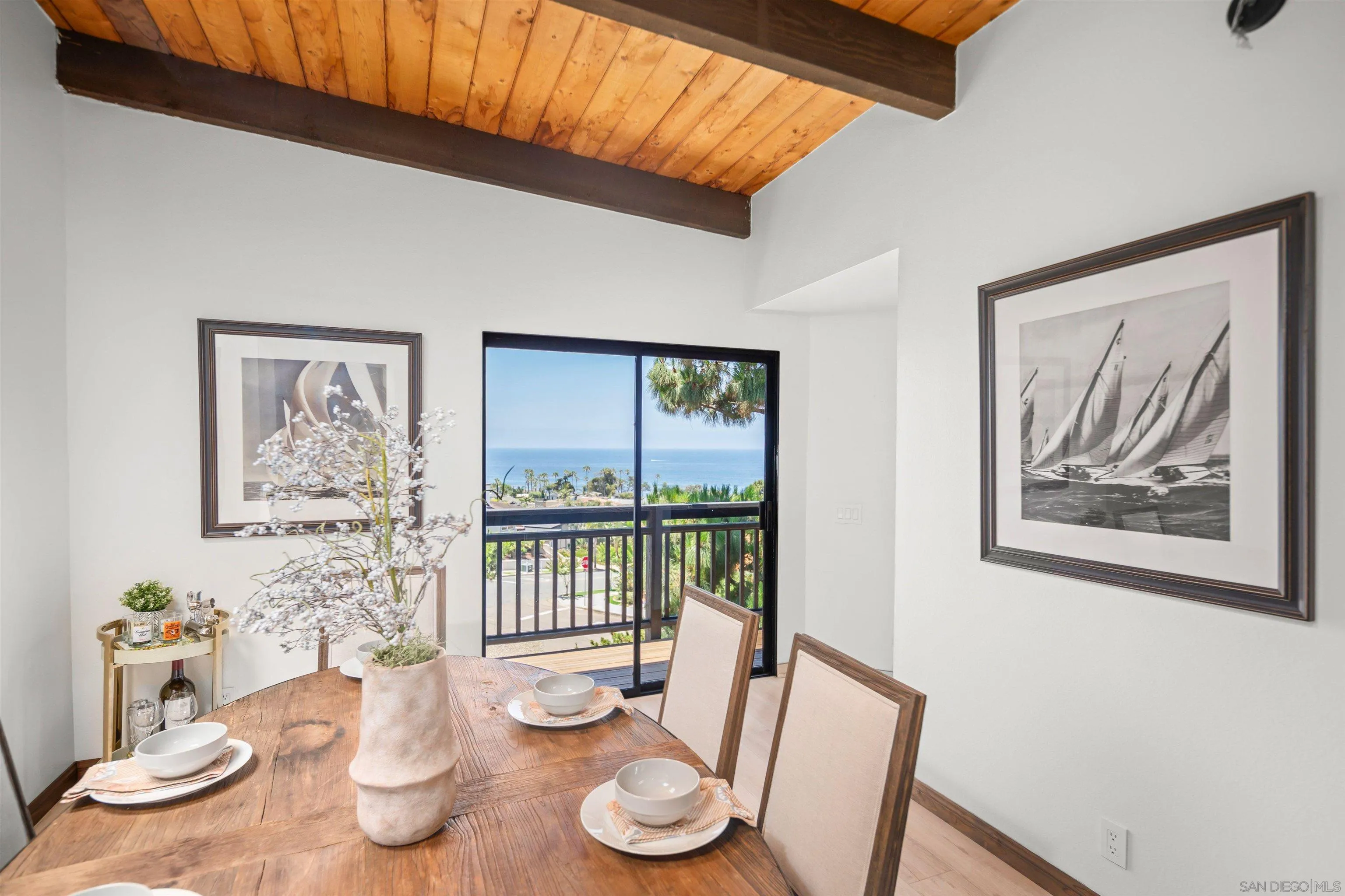 1005 Cornish Drive San Diego, CA 92107 - Photo 13 of 71 a dining room with furniture and wooden floor
