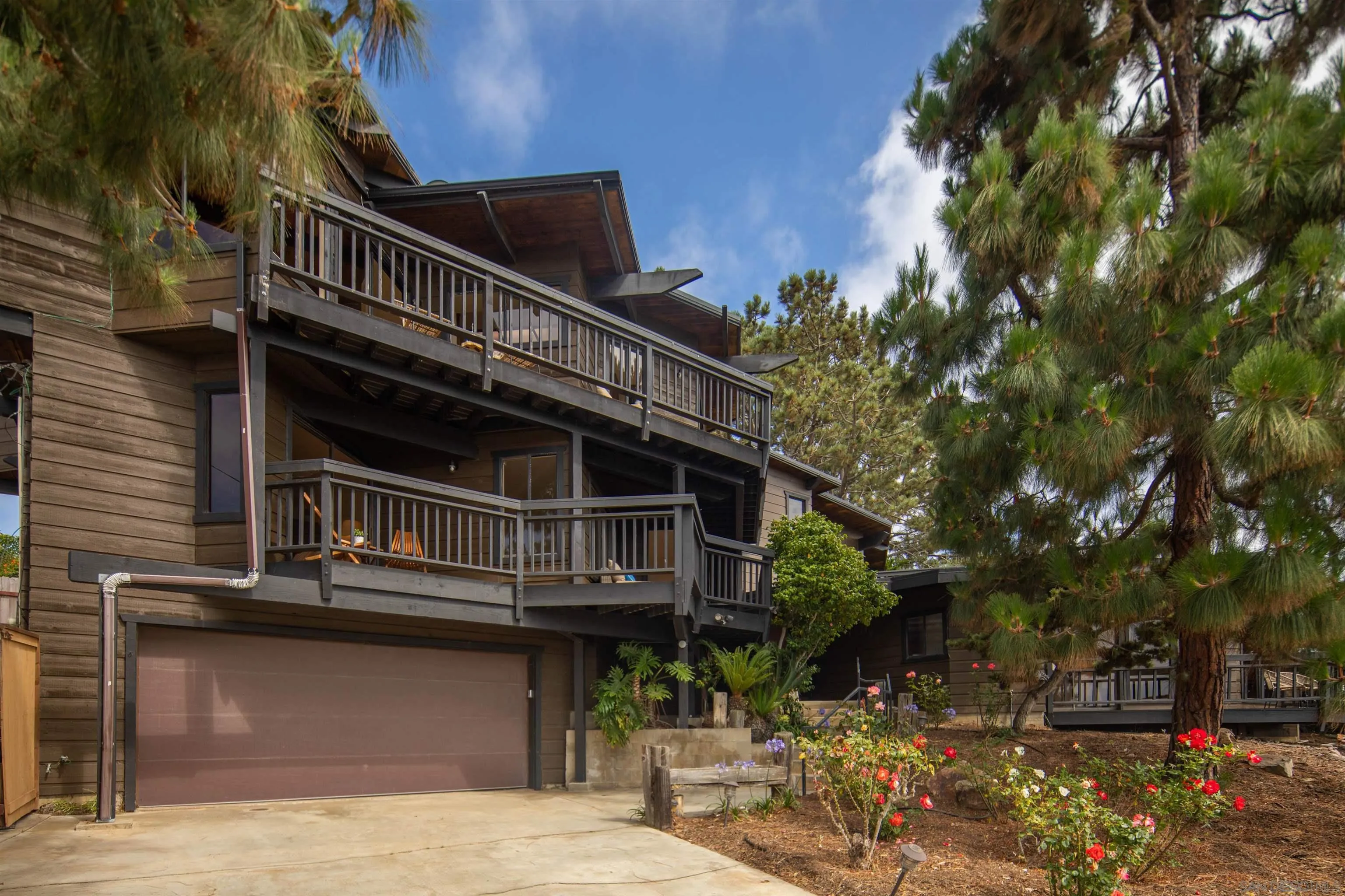1005 Cornish Drive San Diego, CA 92107 - Photo 2 of 71 a view of house with outdoor space and parking