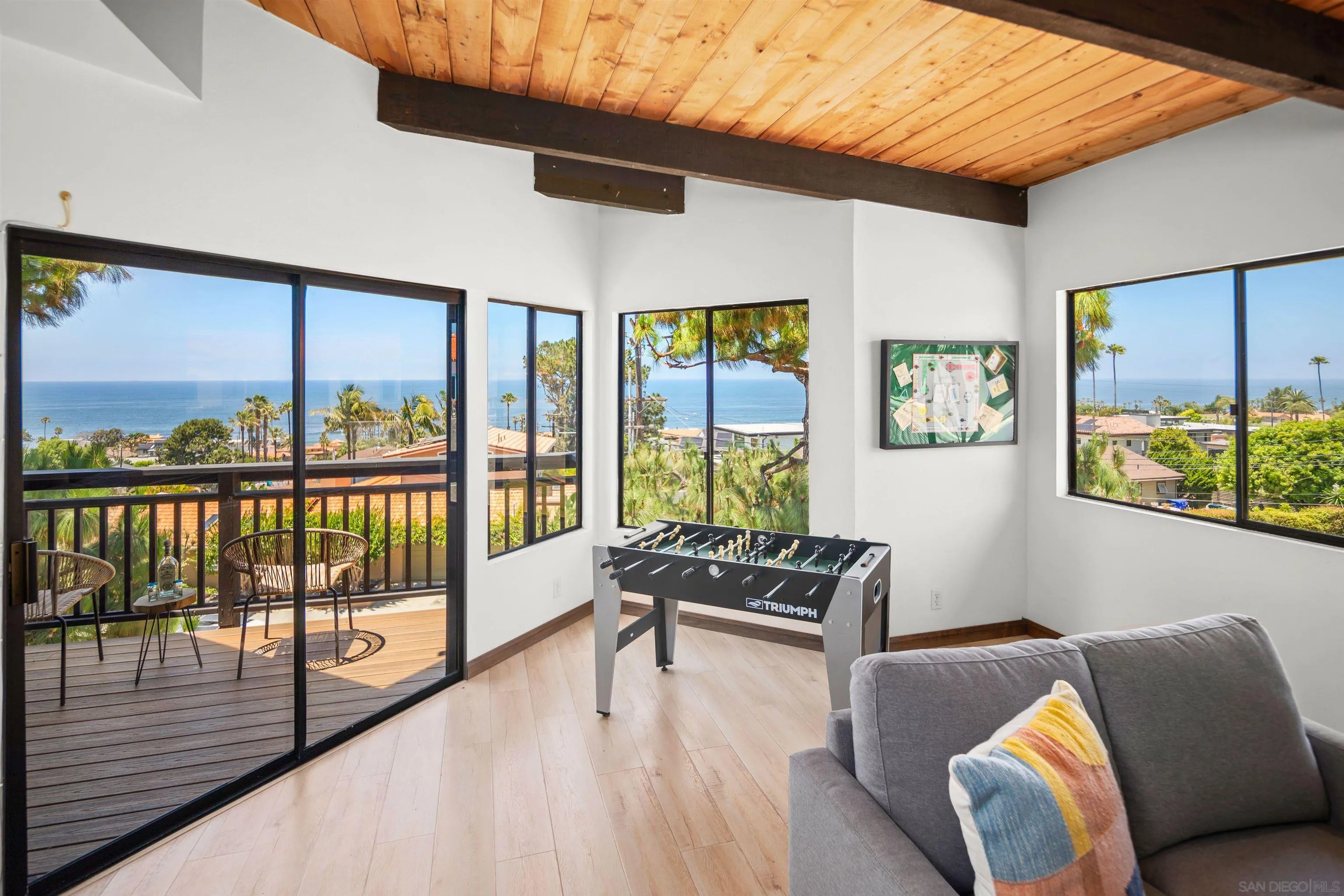 1005 Cornish Drive San Diego, CA 92107 - Photo 22 of 71 a hallway with furniture and large windows