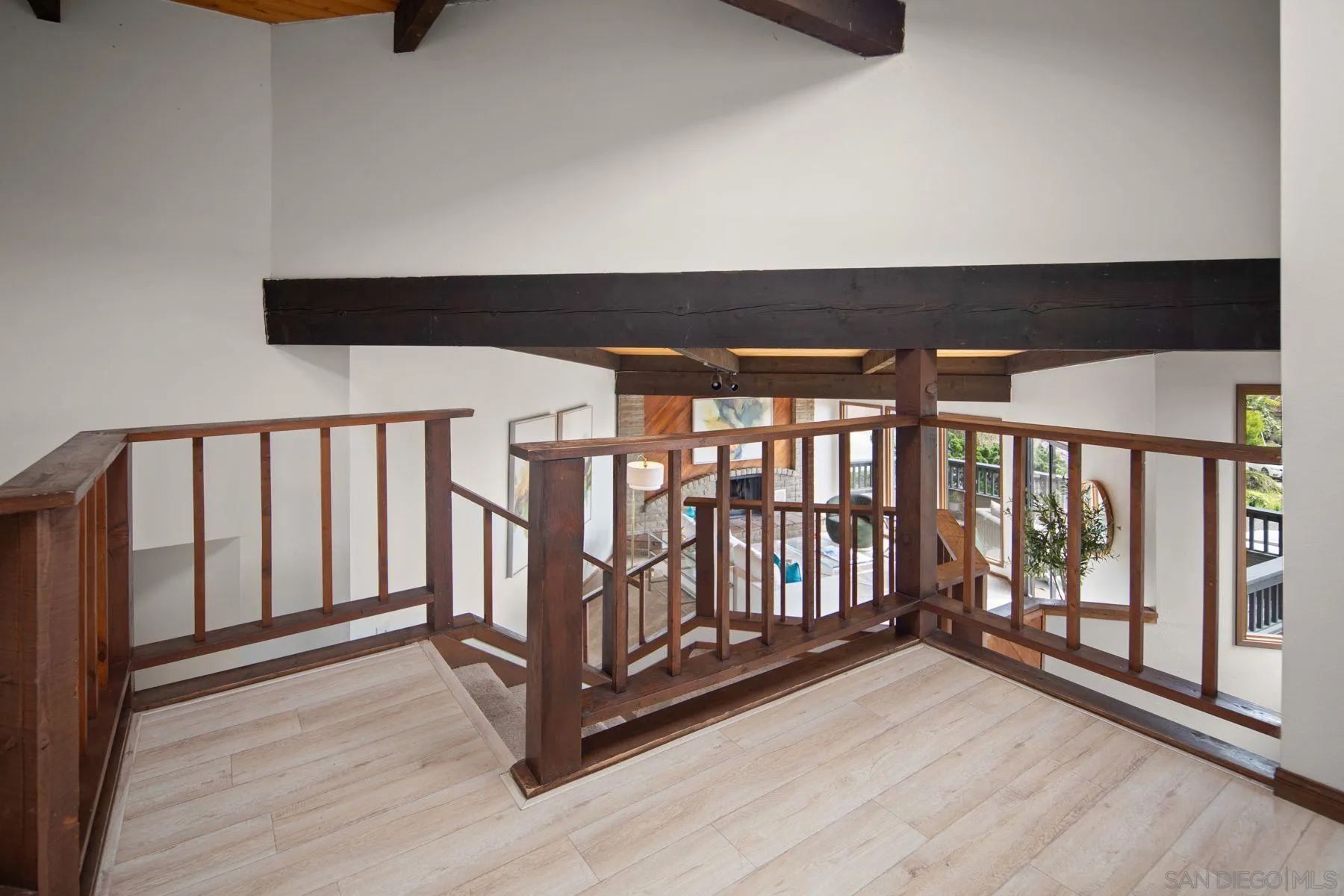 1005 Cornish Drive San Diego, CA 92107 - Photo 28 of 71 a view of a hallway with wooden floor