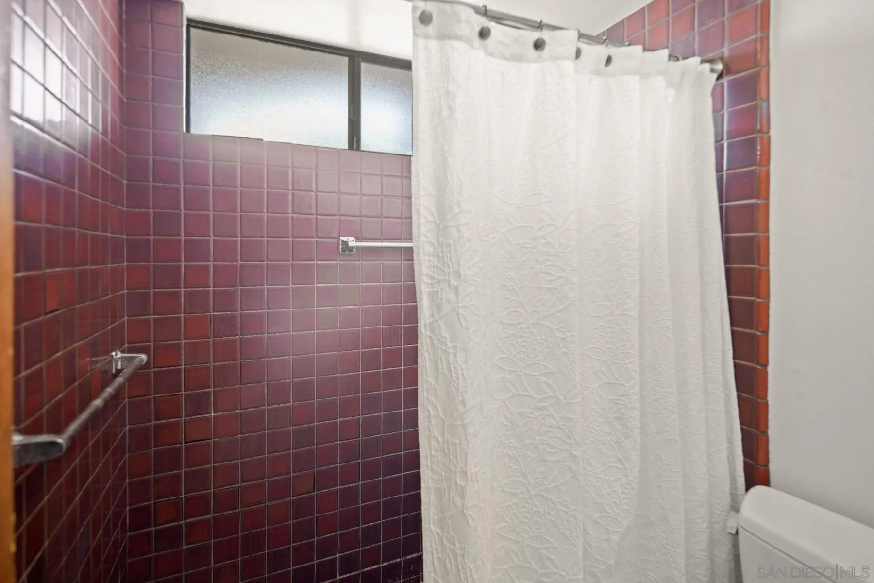 1005 Cornish Drive San Diego, CA 92107 - Photo 43 of 71 a bathroom with a shower curtain and a shower curtain