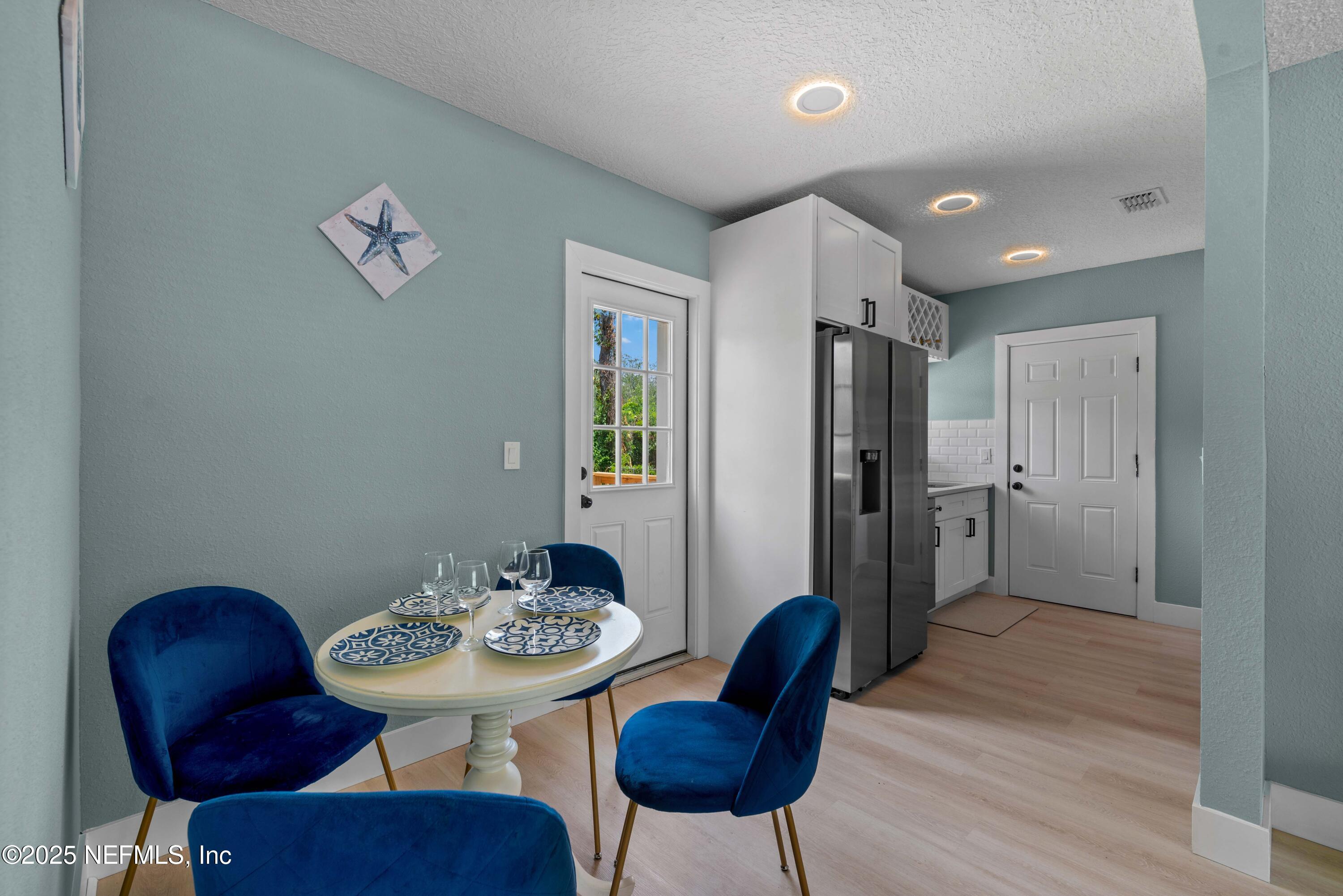 4647 Timuquana Road Jacksonville, FL 32210 - Photo 14 of 27 a view of a dining room with furniture and wooden floor
