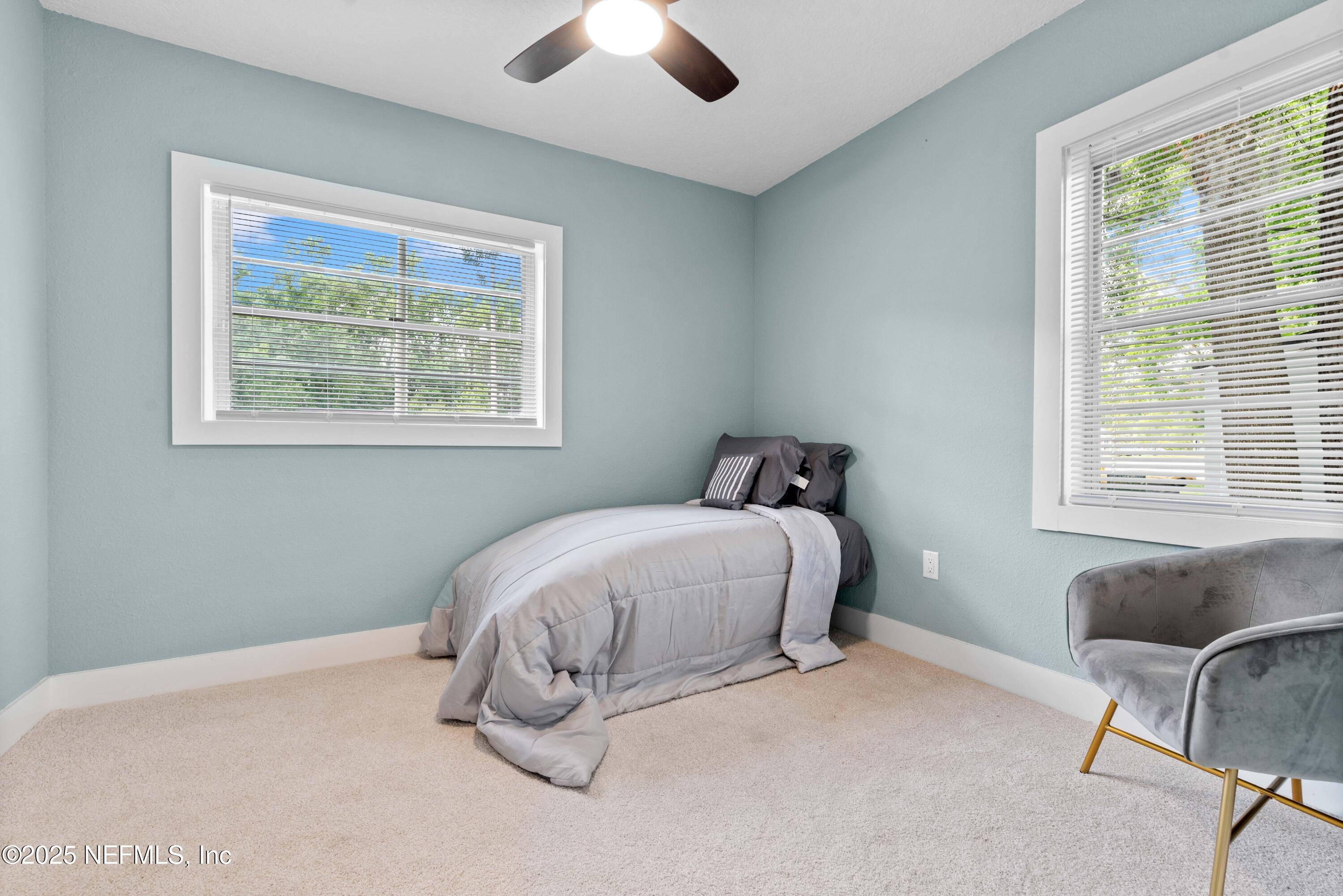 4647 Timuquana Road Jacksonville, FL 32210 - Photo 18 of 27 a bedroom with bed and a window