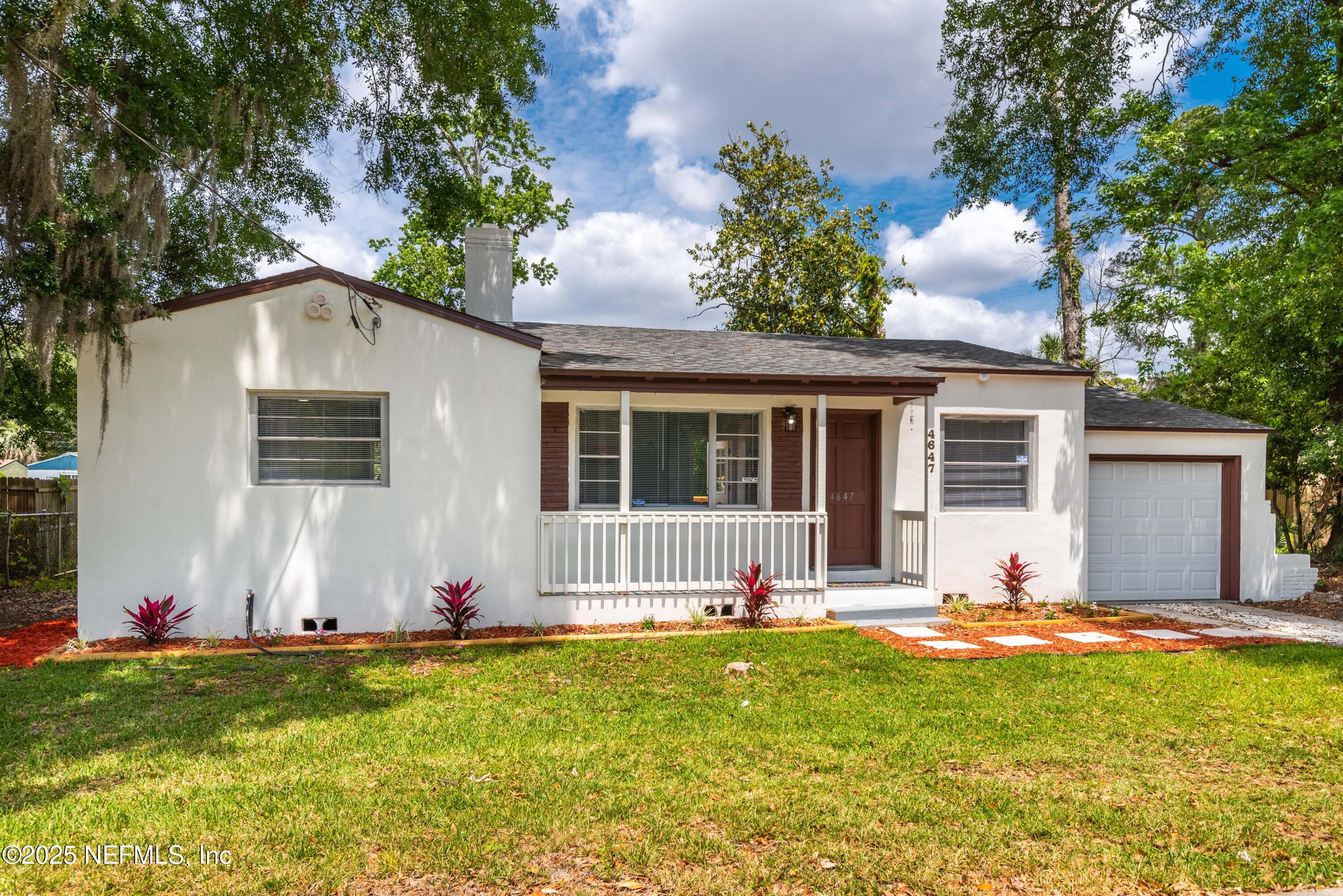 4647 Timuquana Road Jacksonville, FL 32210 - Photo 2 of 27 a view of a house with backyard and sitting area