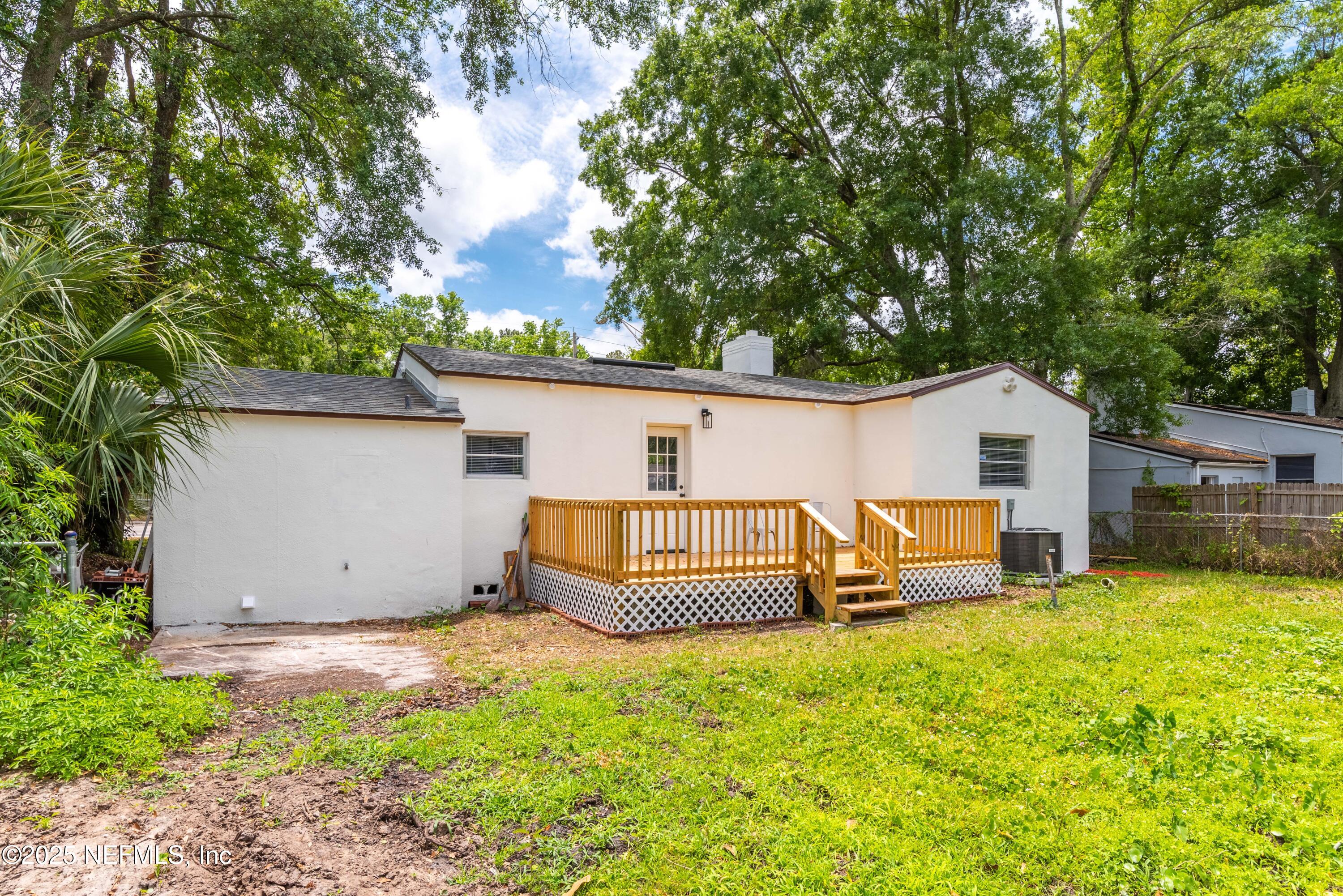 4647 Timuquana Road Jacksonville, FL 32210 - Photo 25 of 27 a view of a house with a yard