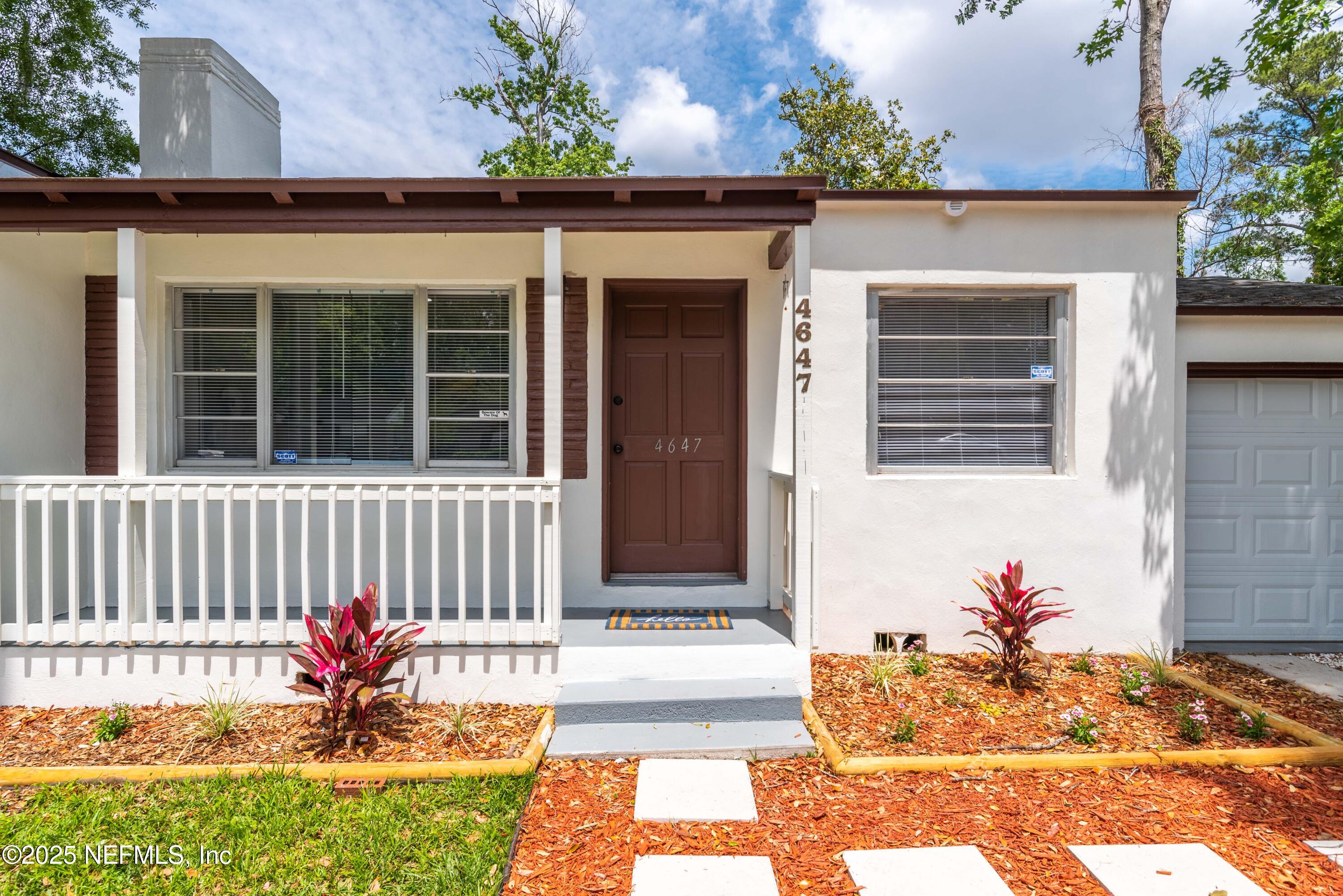 4647 Timuquana Road Jacksonville, FL 32210 - Photo 4 of 27 a front view of a house with a yard