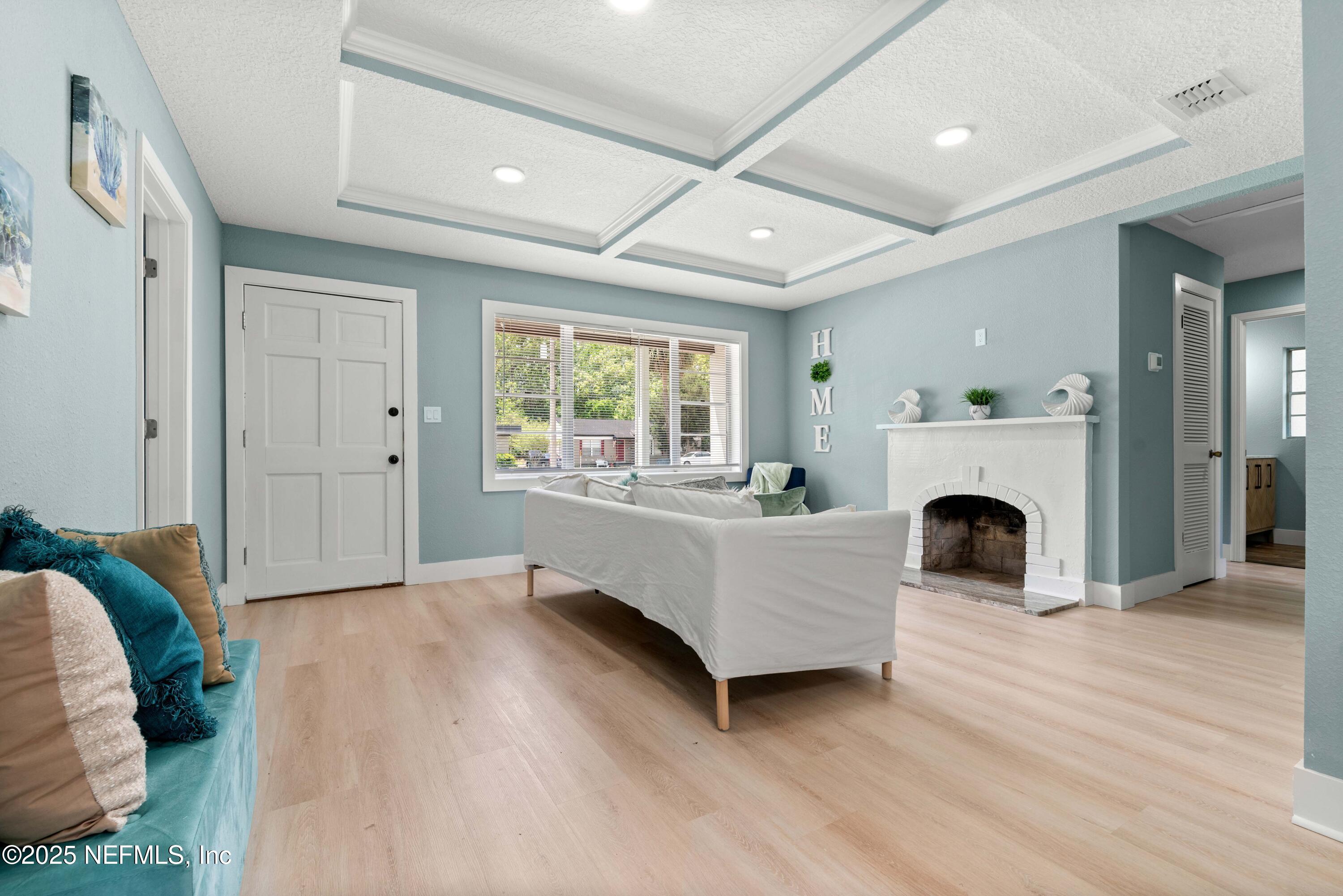 4647 Timuquana Road Jacksonville, FL 32210 - Photo 6 of 27 a living room with furniture and a fireplace