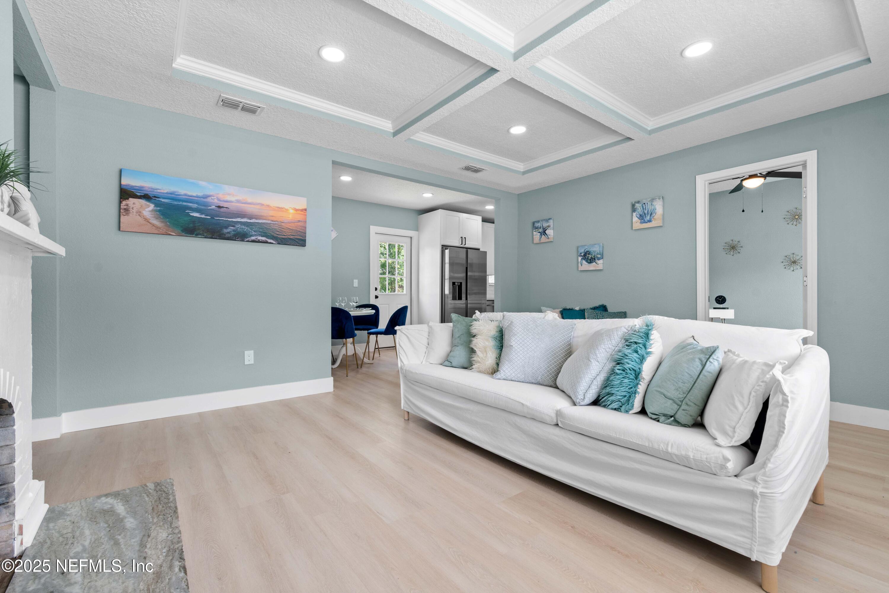 4647 Timuquana Road Jacksonville, FL 32210 - Photo 7 of 27 a view of a livingroom with furniture and wooden floor