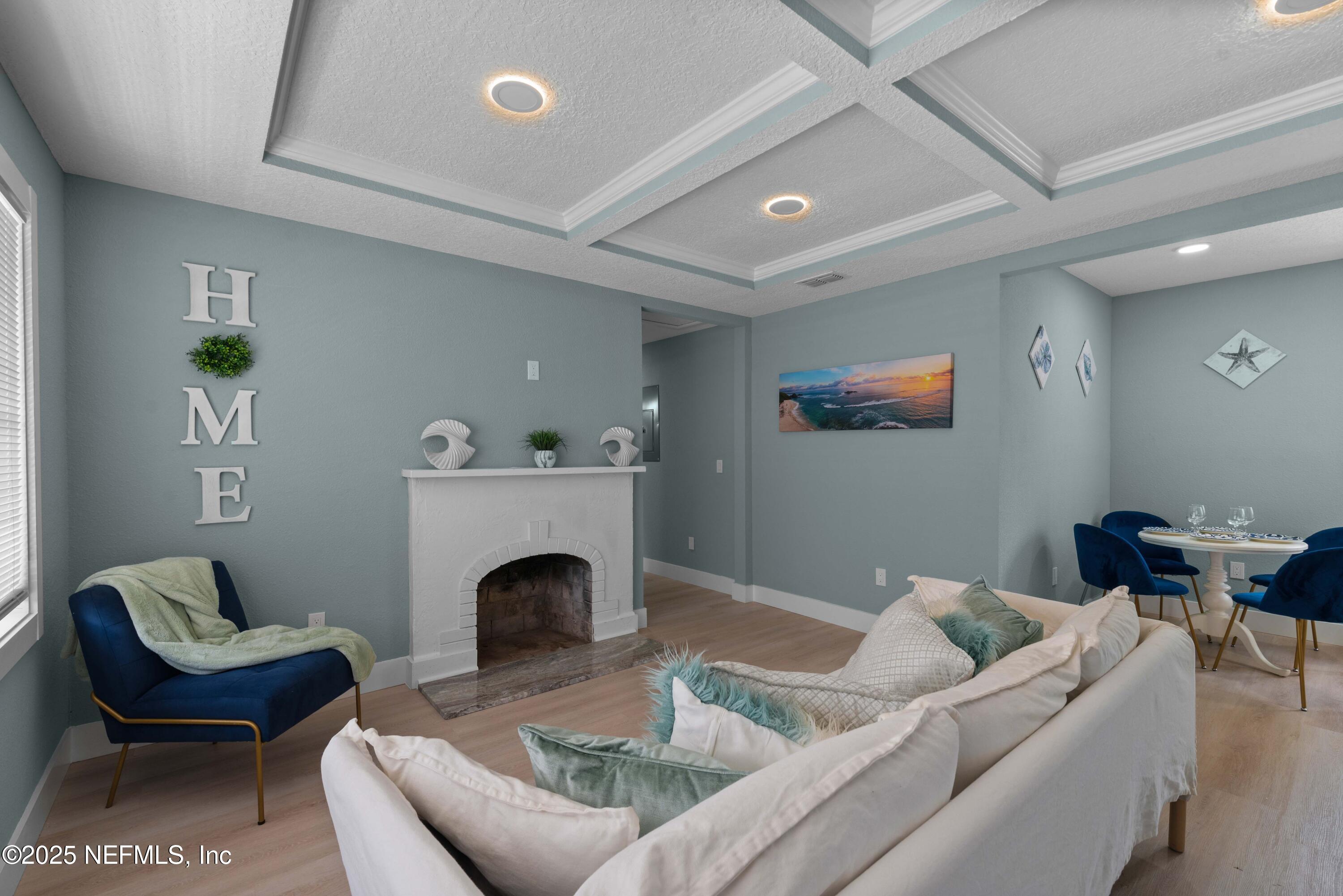 4647 Timuquana Road Jacksonville, FL 32210 - Photo 9 of 27 a living room with furniture and a fireplace