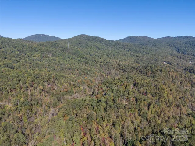 a view of a mountain range in a cloudy sky