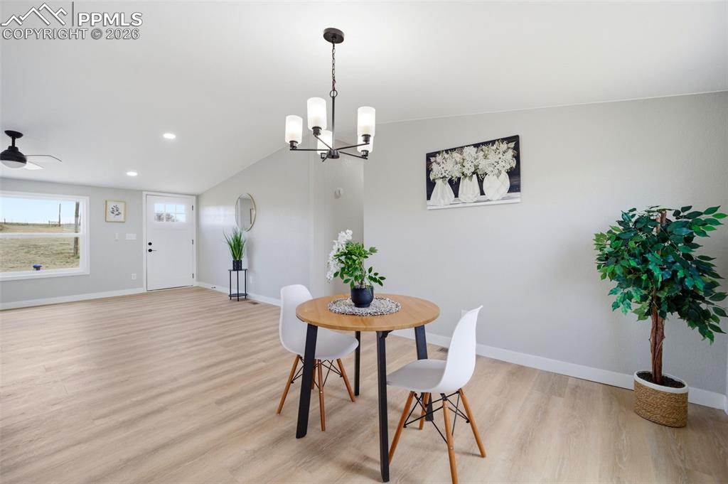 35125 Book Road Yoder, CO 80864 - Photo 21 of 45 a view of a dining room with furniture and a potted plant