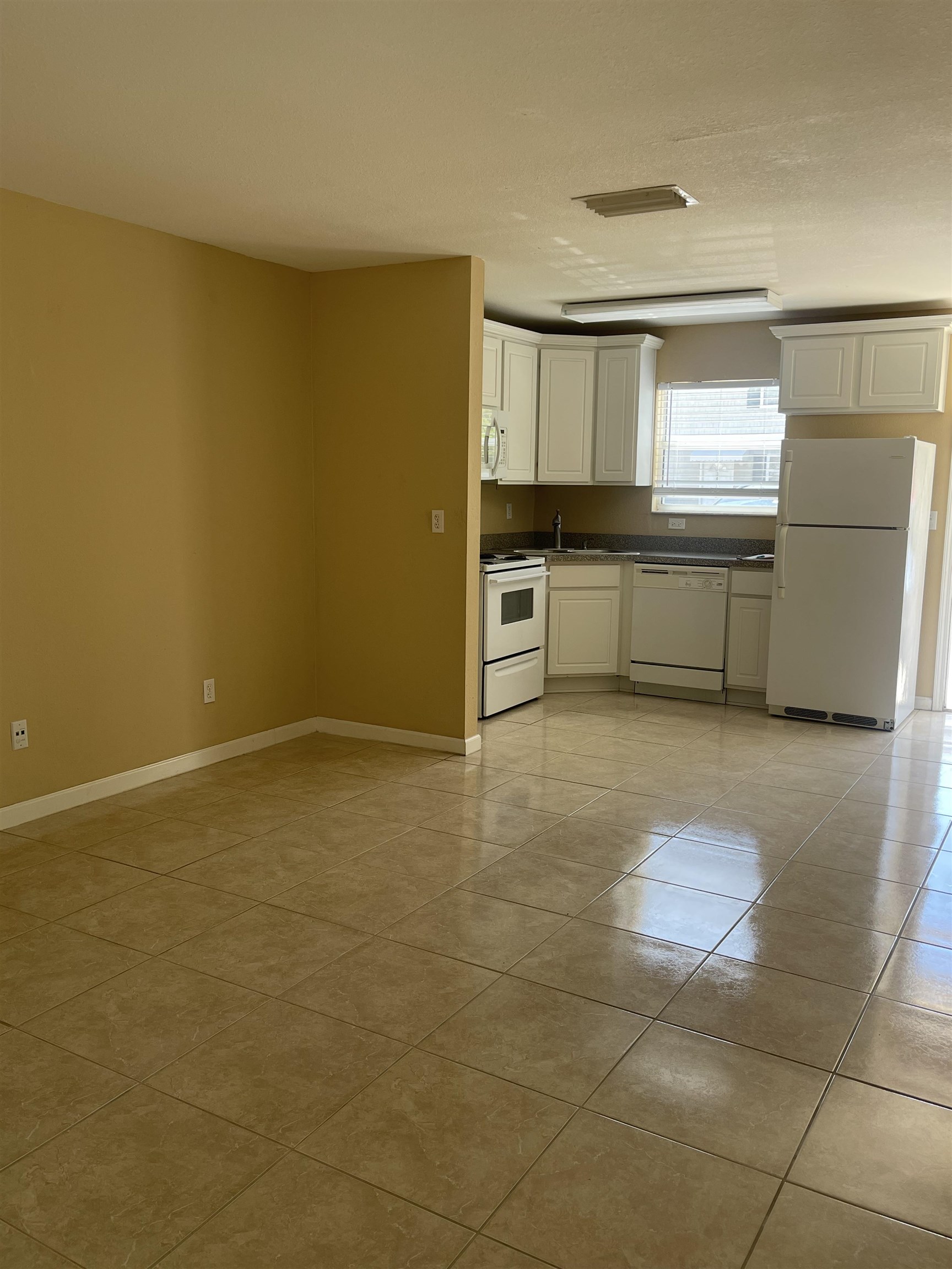 4420 Carter Road, Unit 41 St. Augustine, FL 32086 - Photo 2 of 10 a kitchen with stainless steel appliances a refrigerator and a cabinets