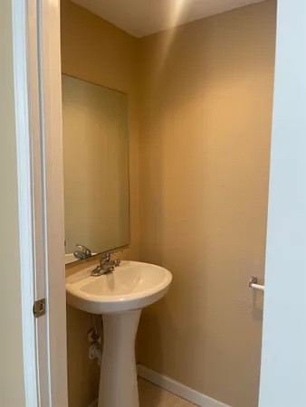 a bathroom with a sink and mirror