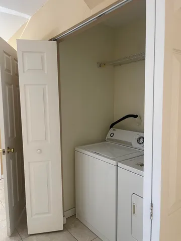 a utility room with dryer and washer