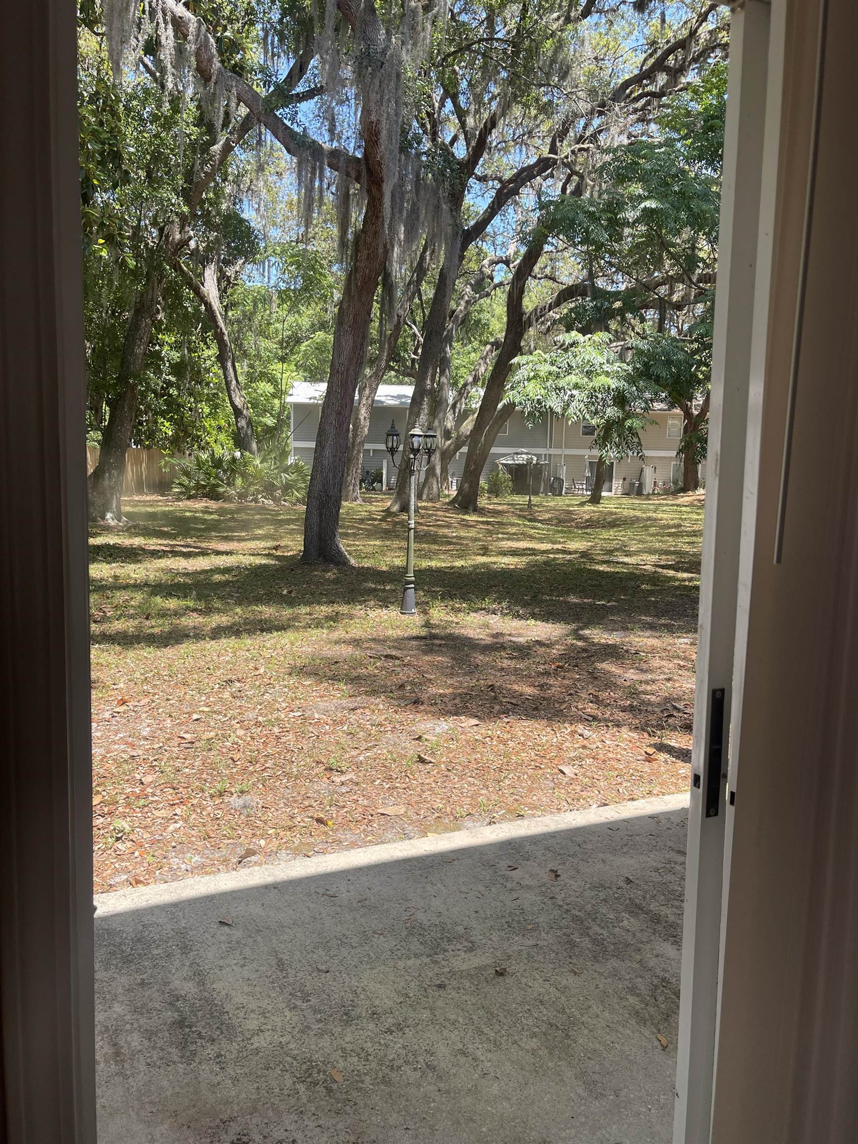 4420 Carter Road, Unit 41 St. Augustine, FL 32086 - Photo 8 of 10 a view of a yard with wooden fence