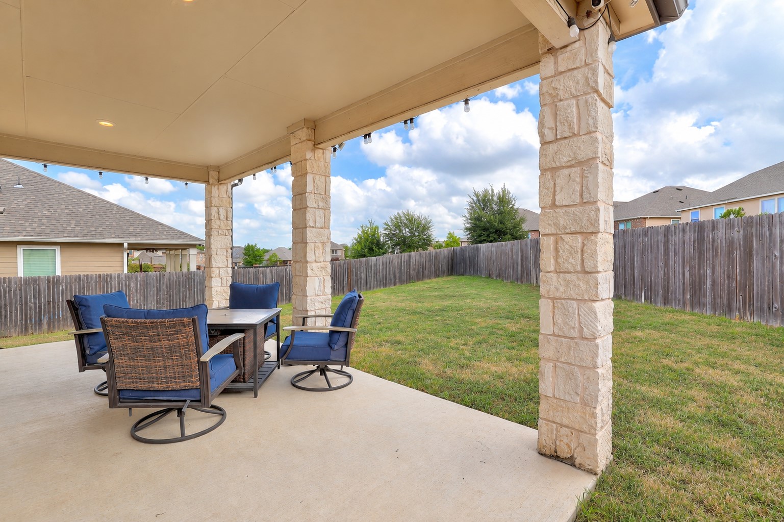 7501 Janes Ranch Road Austin, TX 78744 - Photo 17 of 19 Extended back covered patio is perfect for enjoying the shade during Texas summers... the backyard faces north!