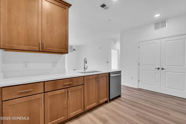 a view of cabinets and wooden floor