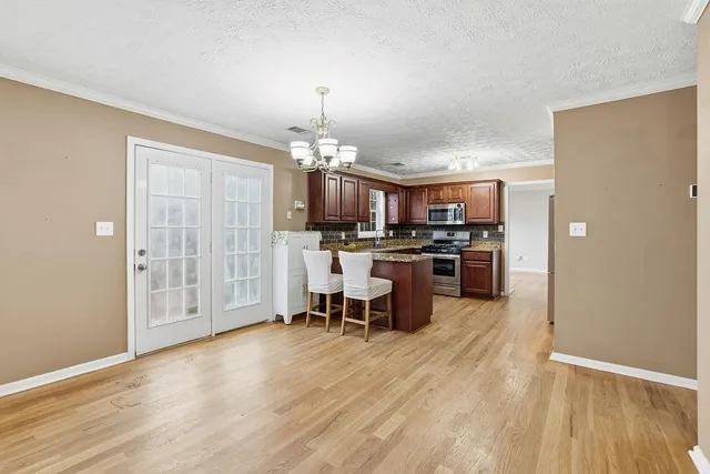 a view of a kitchen and dining room