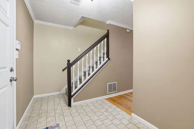 a view of entryway with stairs