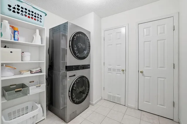 a view of a hallway with washer and dryer
