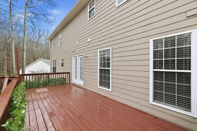 a view of a deck with wooden floor and fence