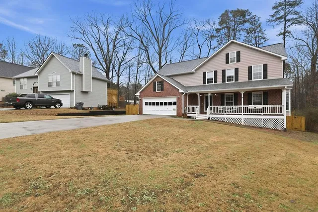 a front view of a house with swimming pool