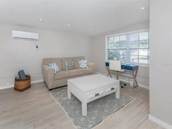a living room with furniture and a table