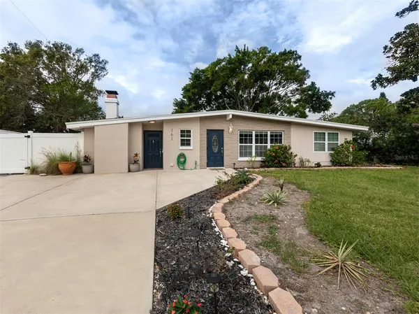 a view of a house with a yard