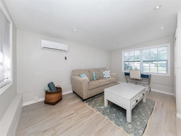 a living room with furniture and a window