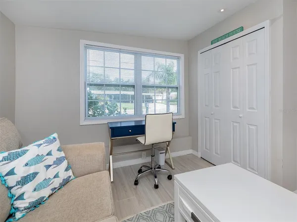 a workspace with furniture and a window