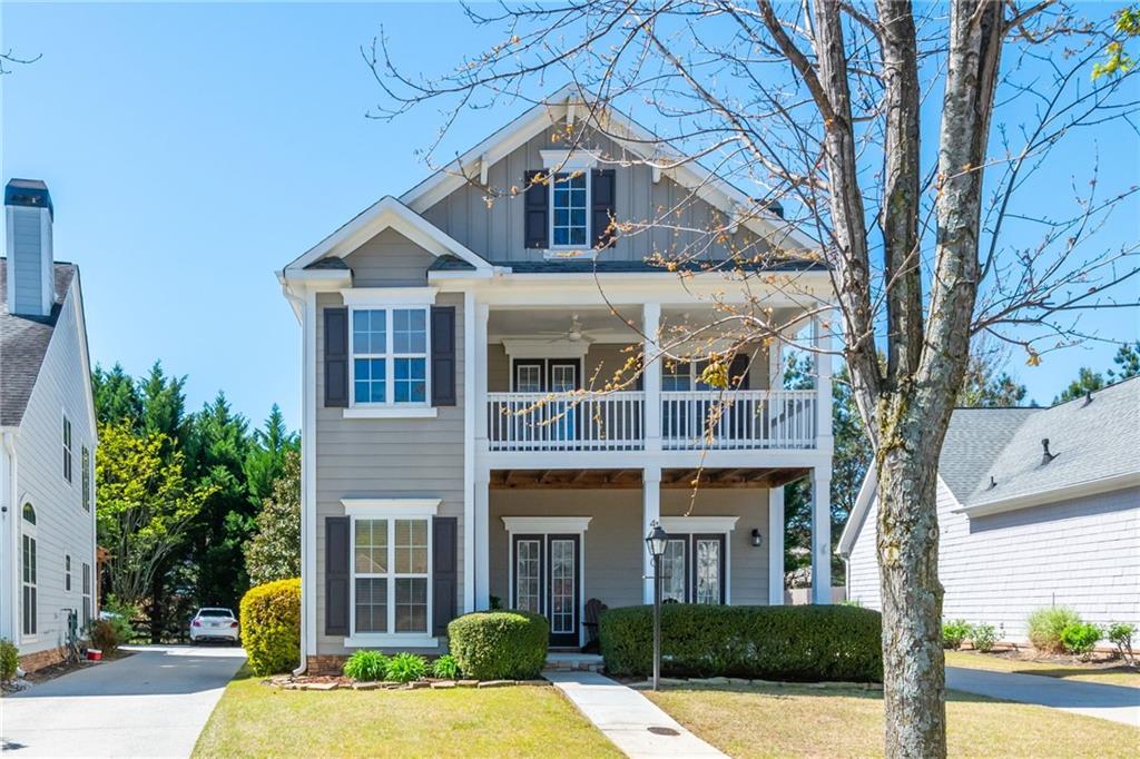 4150 Lake Pass Lane Suwanee, GA 30024 - Photo 1 of 46 a front view of a house with garden