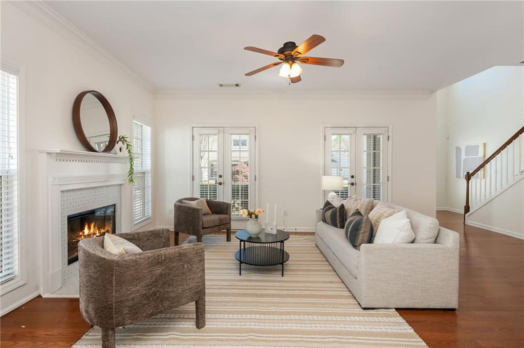 4150 Lake Pass Lane Suwanee, GA 30024 - Photo 13 of 46 a living room with furniture and a fireplace