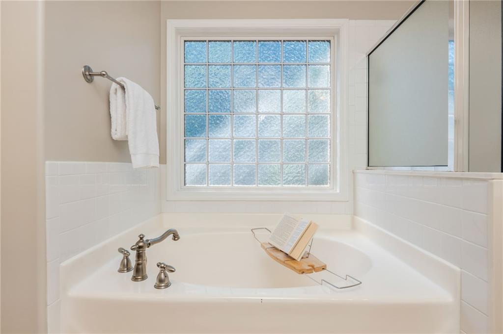 4150 Lake Pass Lane Suwanee, GA 30024 - Photo 29 of 46 a bathroom with a bathtub