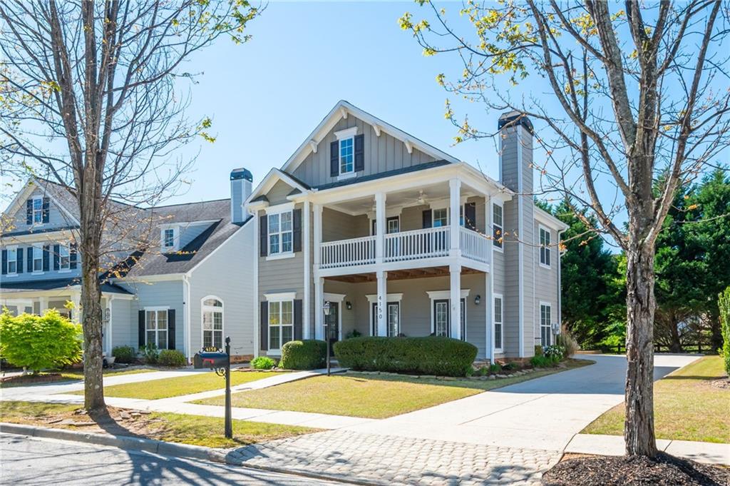 4150 Lake Pass Lane Suwanee, GA 30024 - Photo 3 of 46 a front view of a house with garden