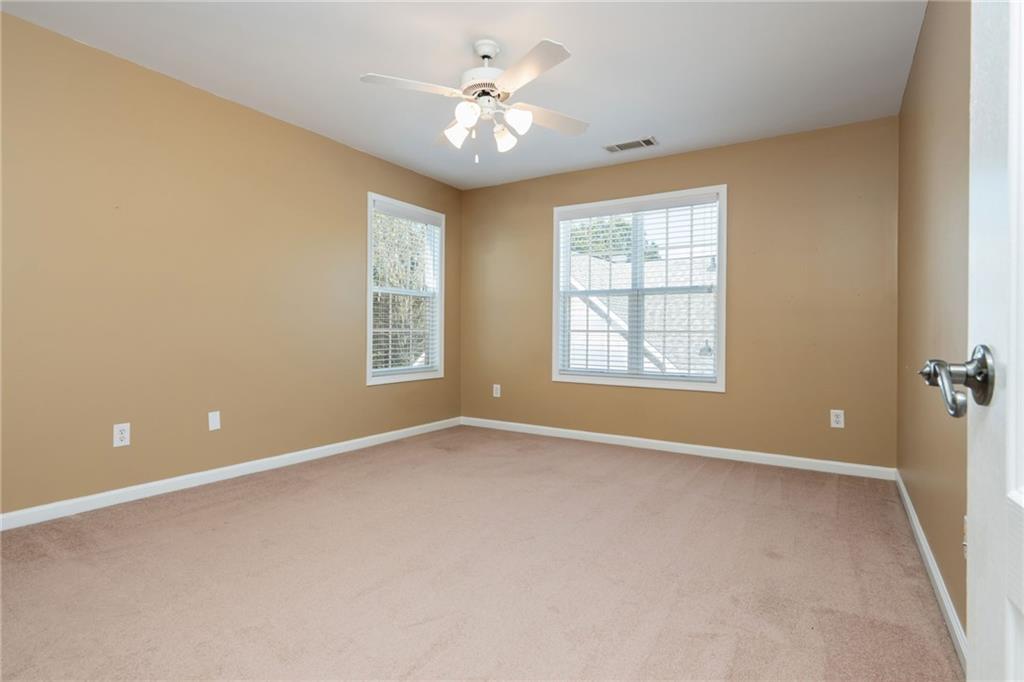 4150 Lake Pass Lane Suwanee, GA 30024 - Photo 35 of 46 a view of an empty room with a window