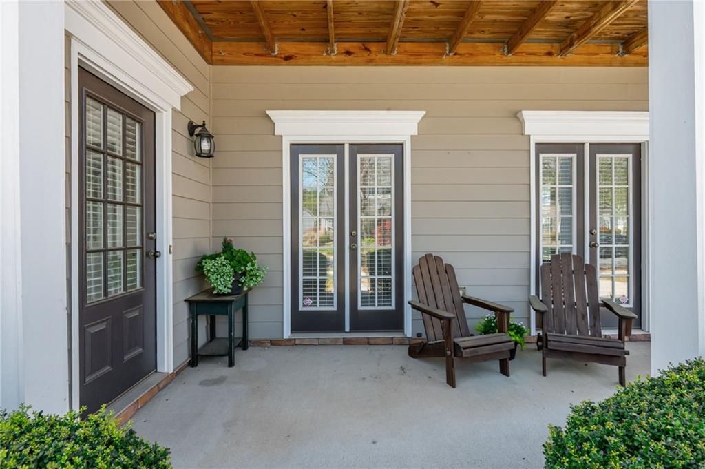 4150 Lake Pass Lane Suwanee, GA 30024 - Photo 41 of 46 a building outdoor space with patio furniture and potted plants