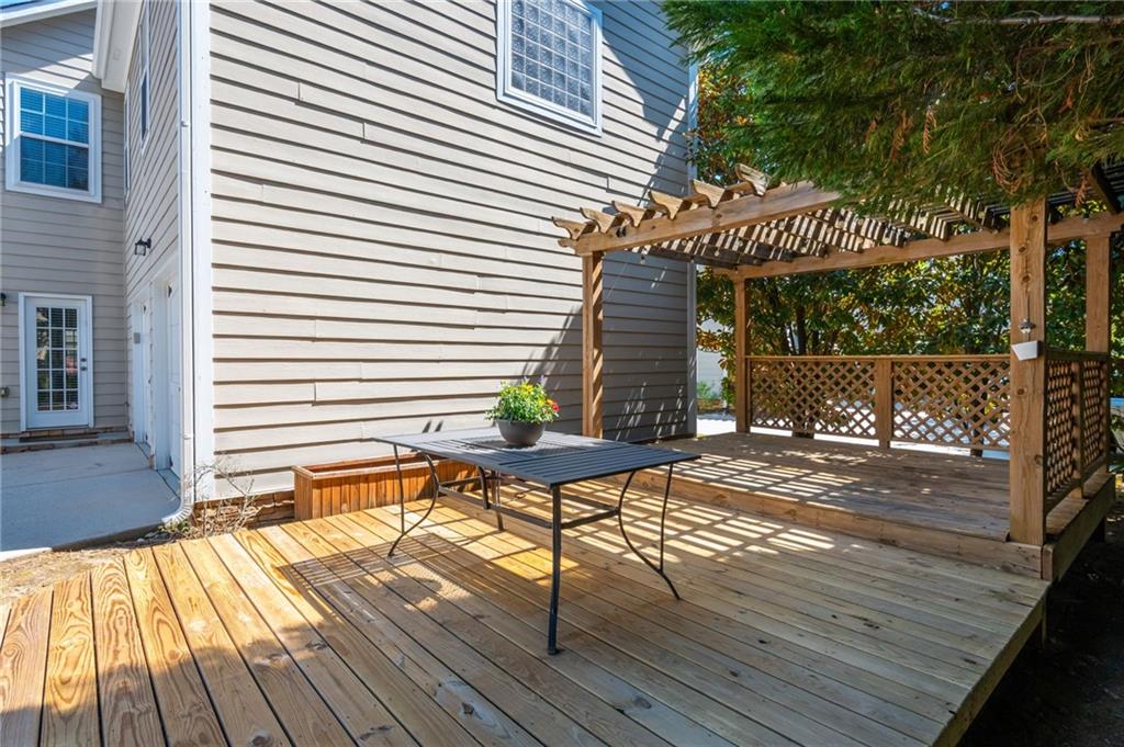 4150 Lake Pass Lane Suwanee, GA 30024 - Photo 46 of 46 a view of a wooden chairs on the roof deck
