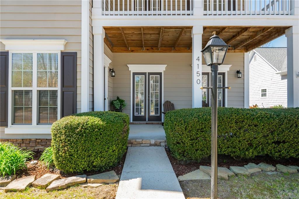 4150 Lake Pass Lane Suwanee, GA 30024 - Photo 5 of 46 a view of a house with a garden