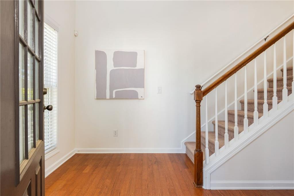 4150 Lake Pass Lane Suwanee, GA 30024 - Photo 6 of 46 a view of an entryway with wooden floor and door