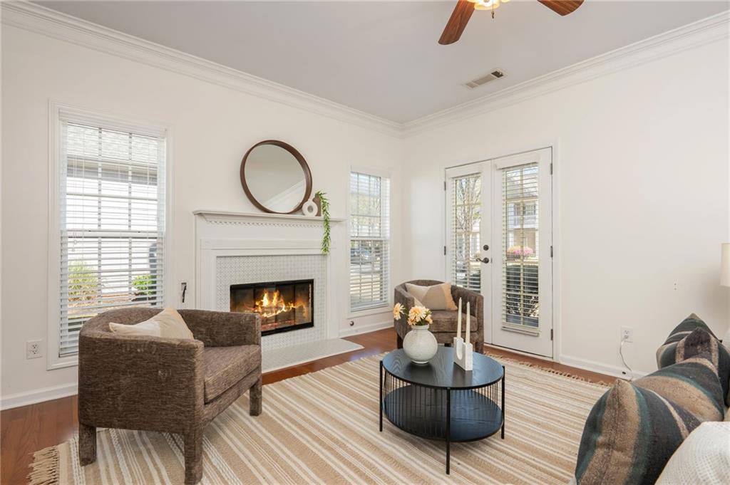 4150 Lake Pass Lane Suwanee, GA 30024 - Photo 8 of 46 a living room with furniture and a fireplace