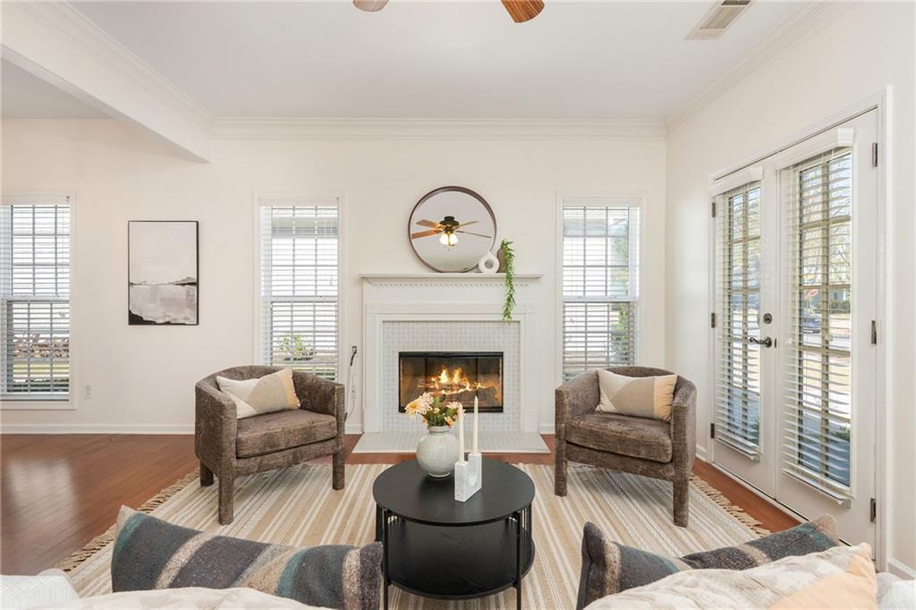 4150 Lake Pass Lane Suwanee, GA 30024 - Photo 9 of 46 a living room with furniture and a fireplace