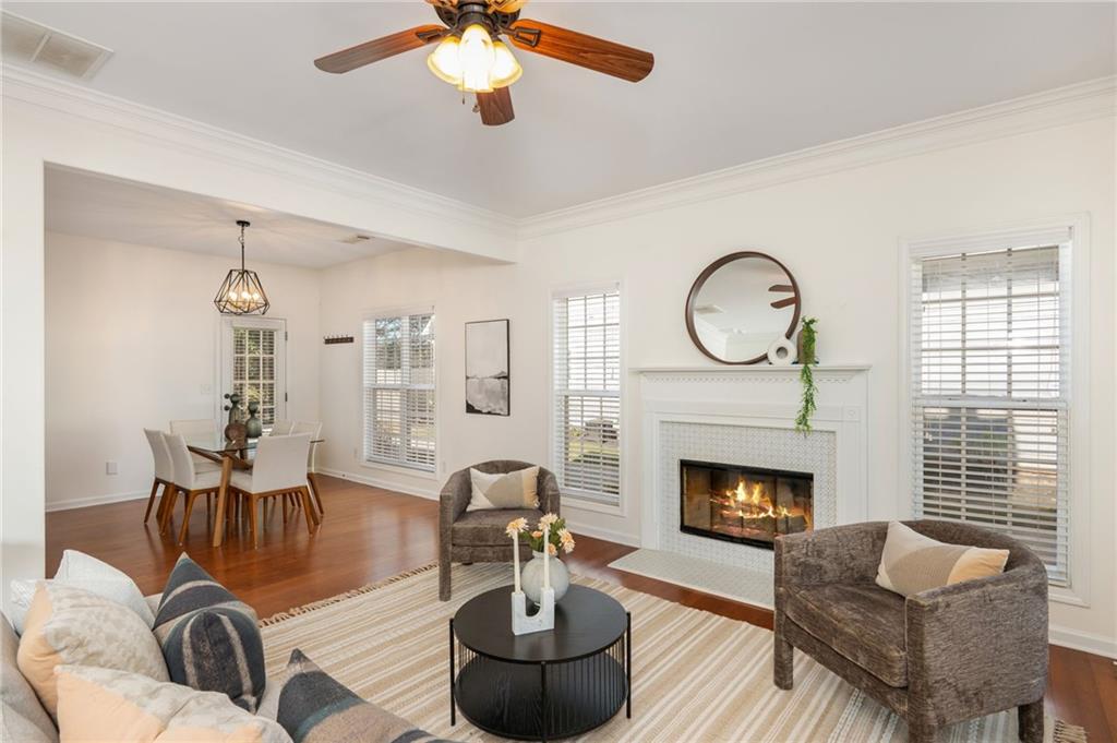 4150 Lake Pass Lane Suwanee, GA 30024 - Photo 10 of 46 a living room with furniture and a fireplace