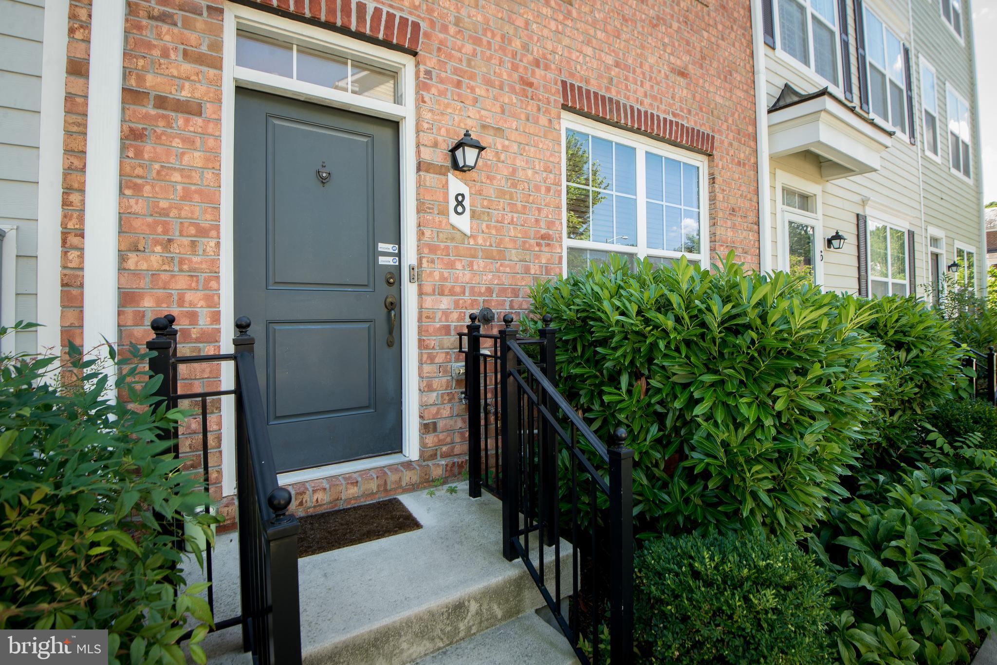 a view of an entrance of the house and trees