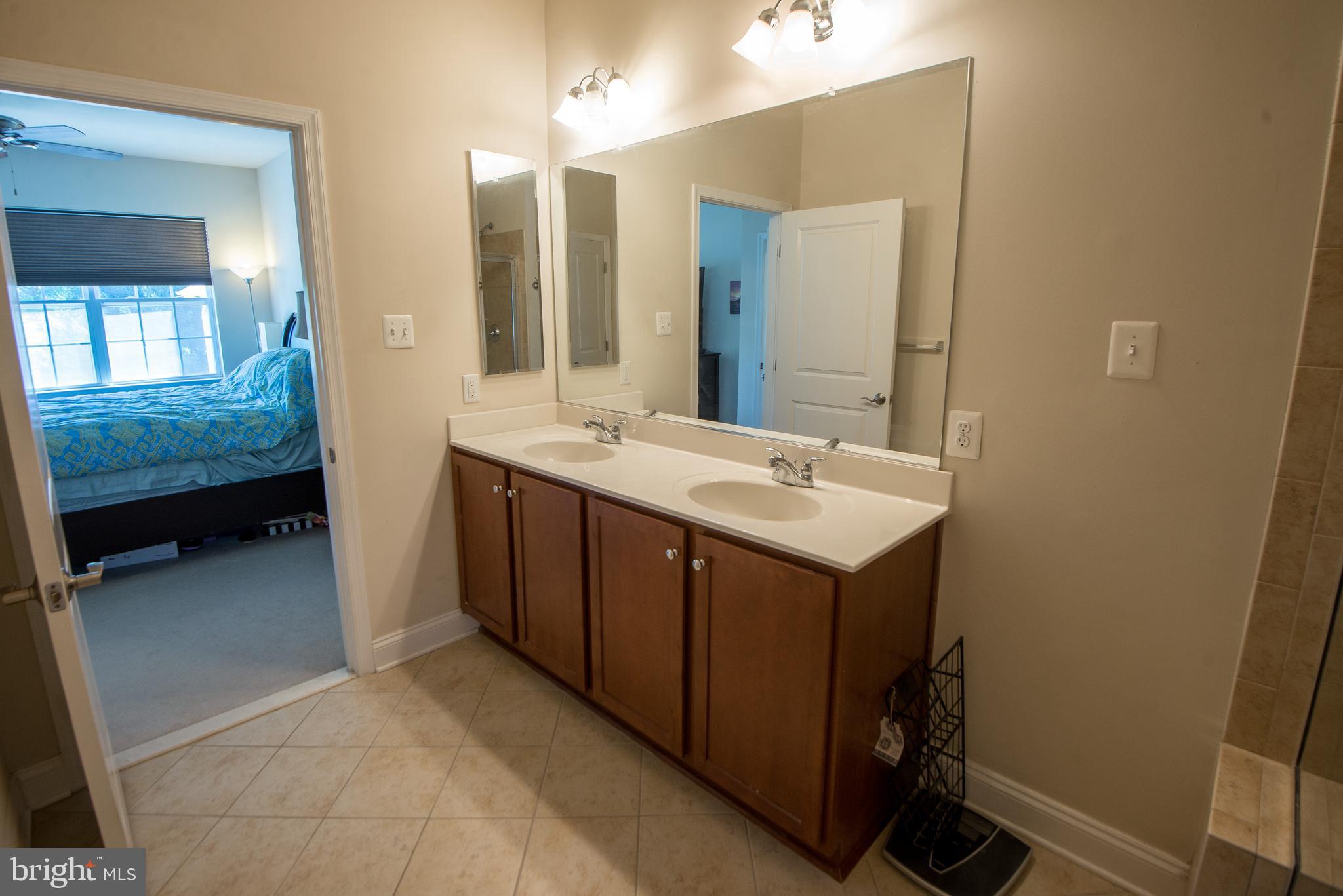 8 Meridian Lane Towson, MD 21286 - Photo 18 of 39 a bathroom with a sink and a mirror