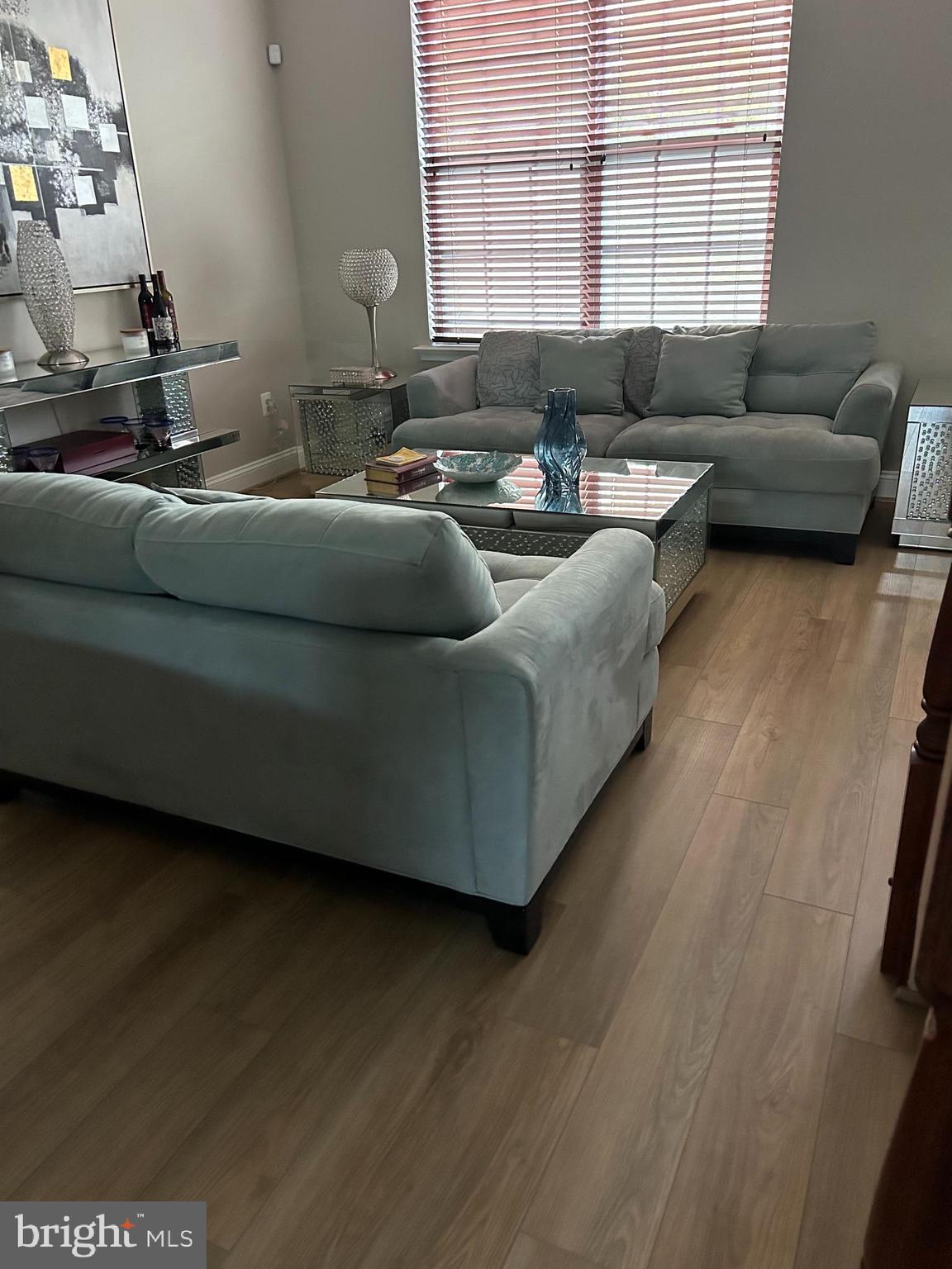 8 Meridian Lane Towson, MD 21286 - Photo 2 of 39 a living room with furniture and a window