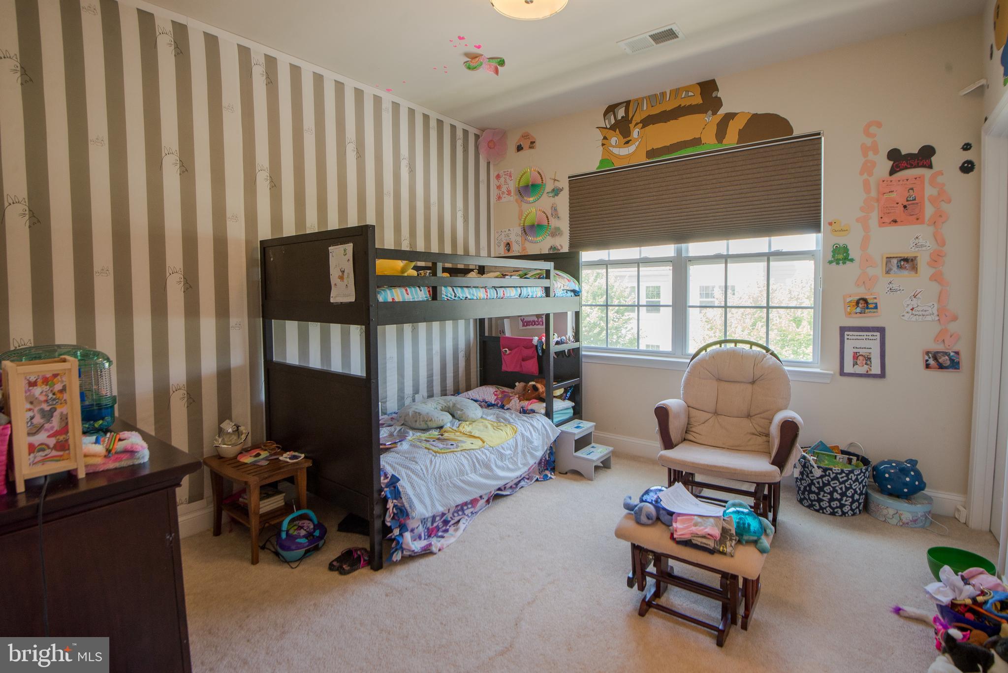 8 Meridian Lane Towson, MD 21286 - Photo 21 of 39 a living room with furniture a rug and a flat screen tv